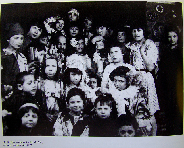 Black and white photograph of a group of about twenty children looking at the camera.